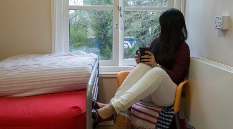 vulnerable woman in refuge space